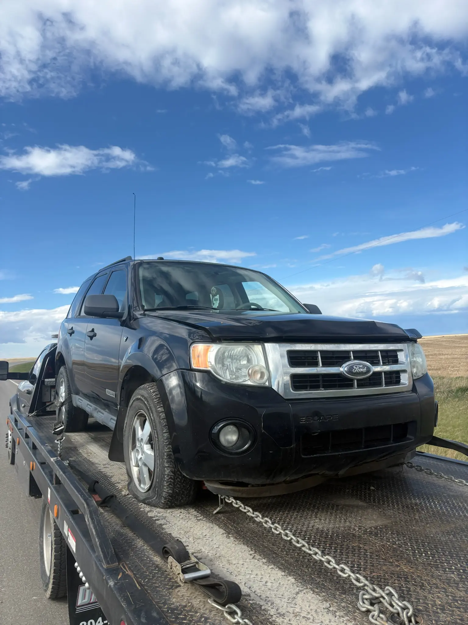 Mechanic estimating damaged car repair costs